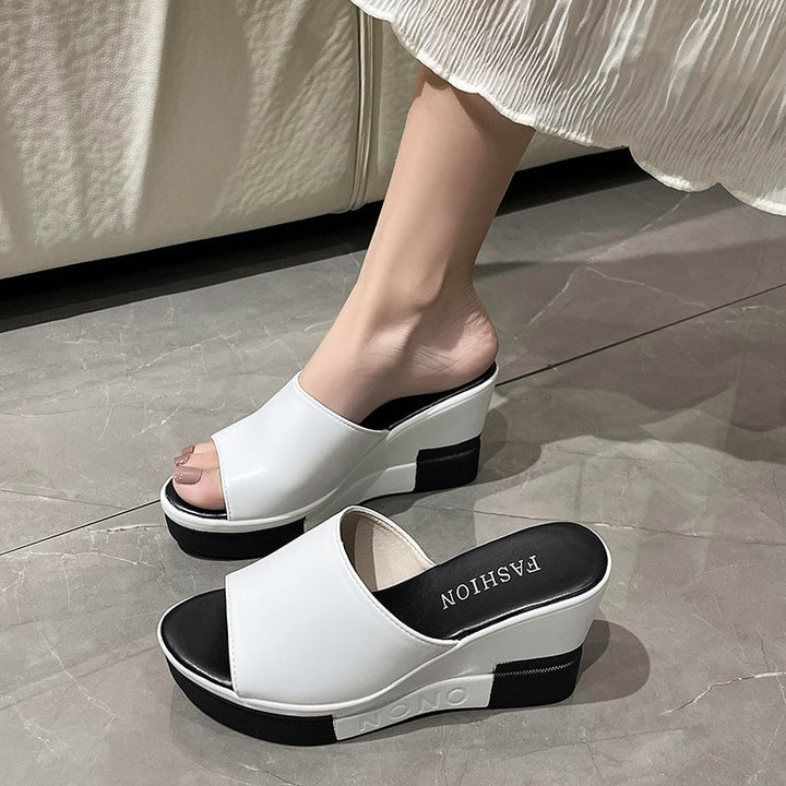 Women's slip-on sandals made of synthetic leather finish with open toe area, ergonomic wedge heel, and padded comfort footbed Mune Fashion
