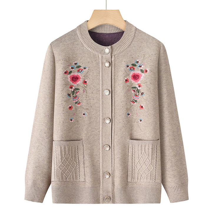 Women's embroidered cardigan with round neckline, decorative button placket, and patch pockets Mune Fashion