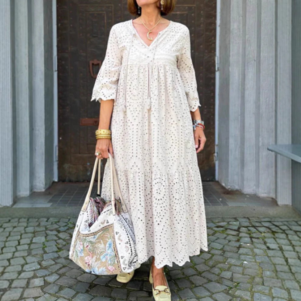 Women's flowing maxi dress with openwork embroidery, V-neck, underbust seam, and ruffled skirt Mune Fashion