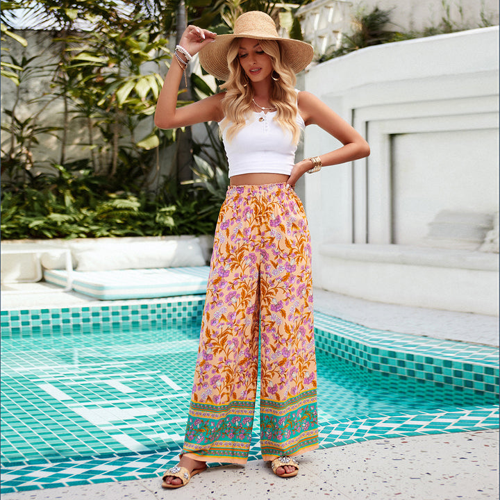 Women's wide Palazzo pants with gathered waistband, side pockets, and floral Boho print Mune Fashion