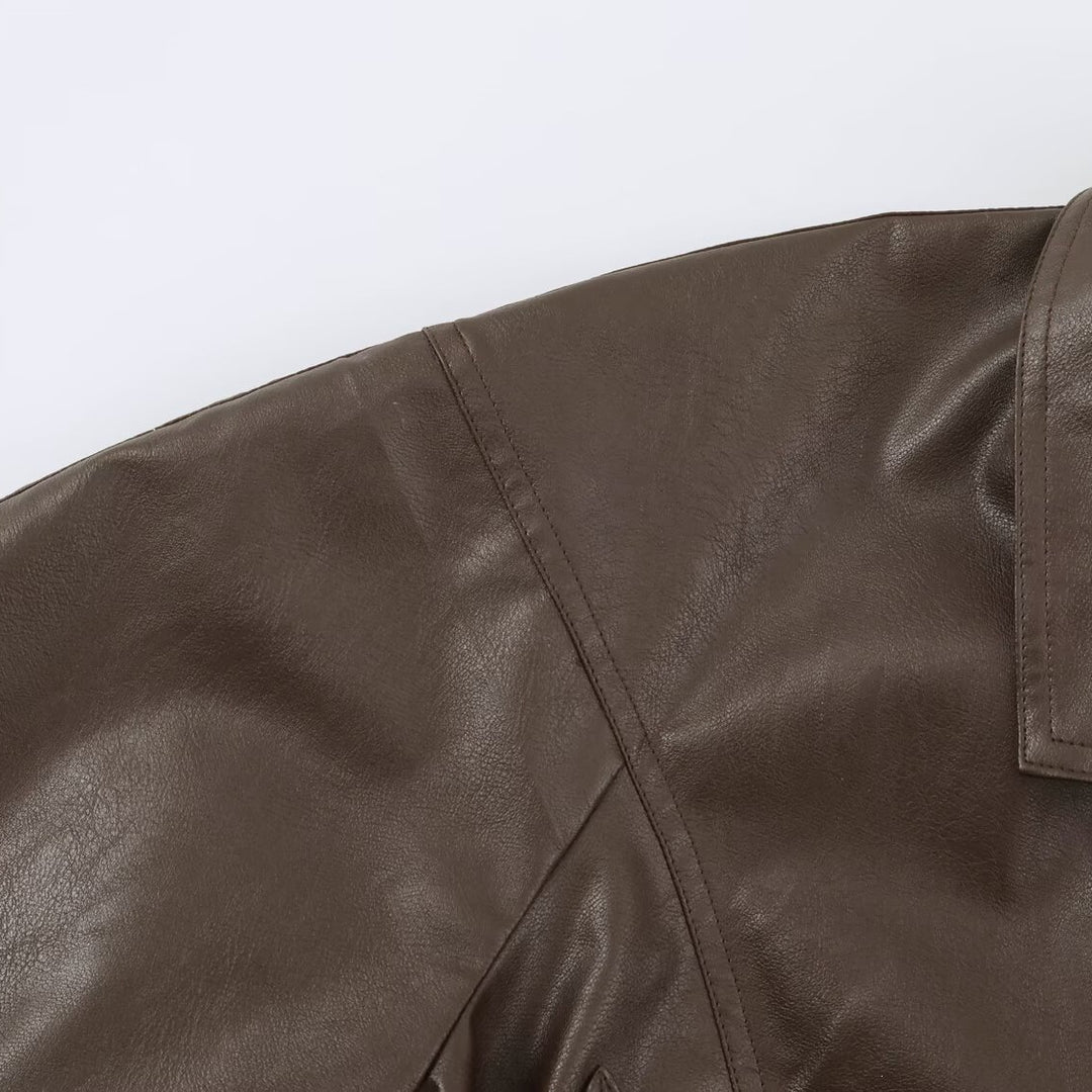 Women's short jacket in leather look with tie belt and asymmetrical button placket Mune Fashion