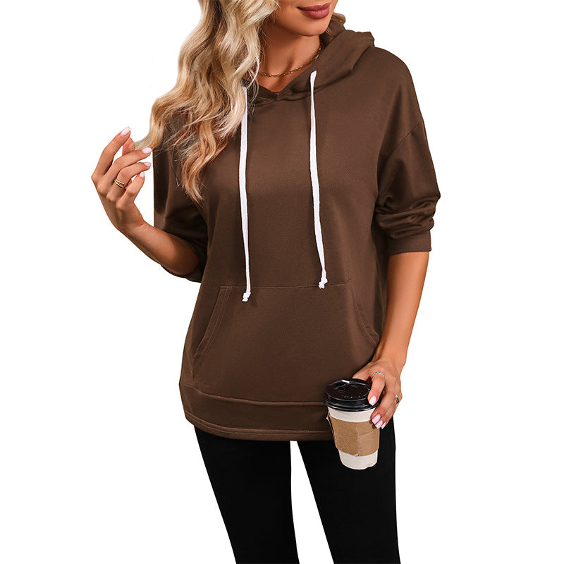 Women's hoodie with kangaroo pocket, loose silhouette and three-quarter sleeves Mune Fashion