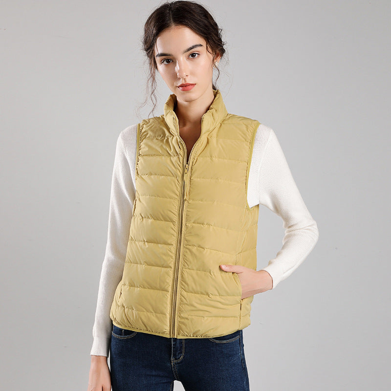Women's packable quilted vest with flat down look, stand-up collar and side slip pockets Mune Fashion