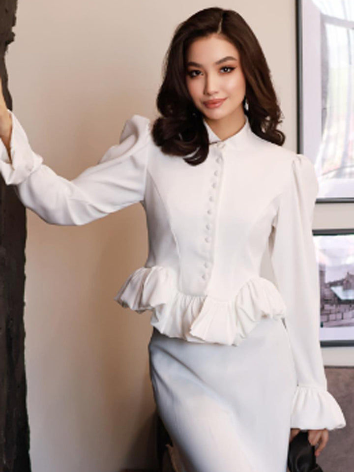 Ladies tailored peplum blouse with stand-up collar, covered button placket and puff sleeves Mune Fashion