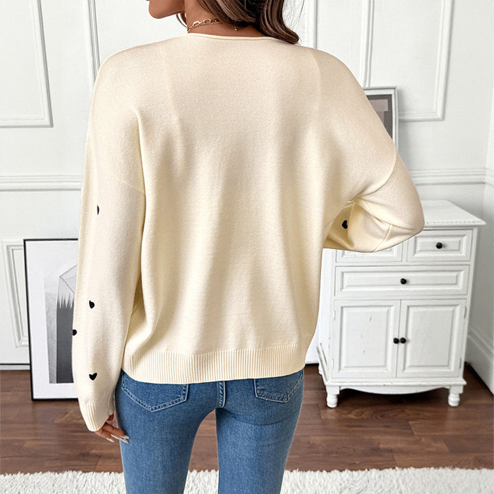 Women's fine knit cardigan with decorative bow closures and heart motif Mune Fashion