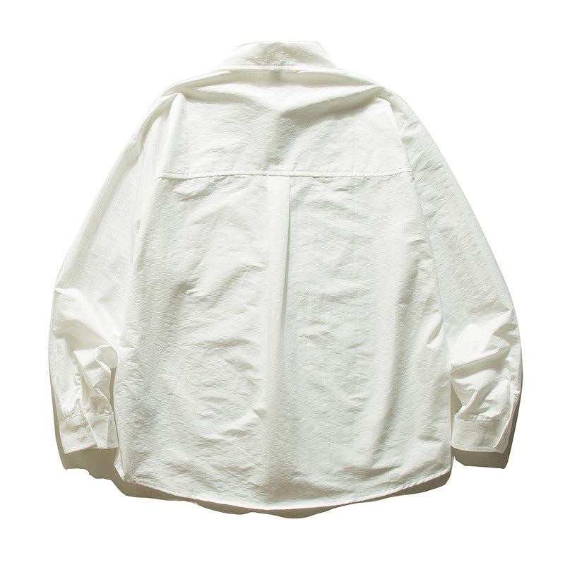 Unisex Oversize cotton shirt with boxy cut, breast pocket, and rounded hem Mune Fashion