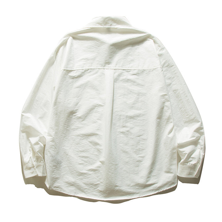 Unisex Oversize cotton shirt with boxy cut, breast pocket, and rounded hem Mune Fashion