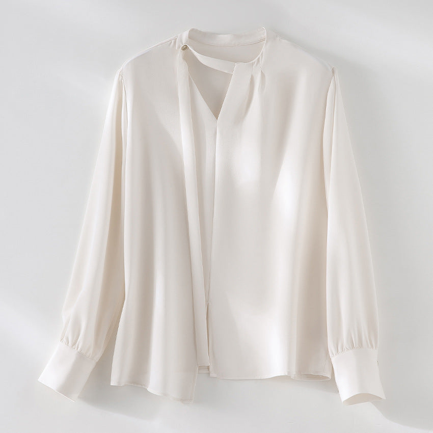 Women's elegant oversized blouse with asymmetrical V-neck and cuffed sleeves Mune Fashion