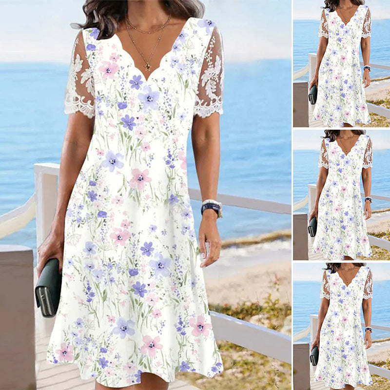Women's A-line midi dress with wavy V-neck, all-over floral pattern and transparent lace sleeves Mune Fashion