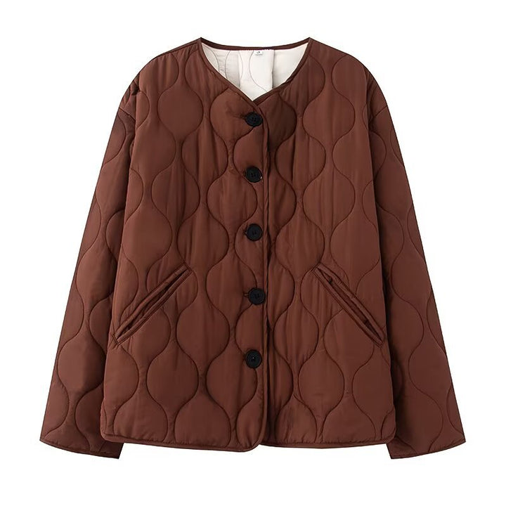 Women's quilted jacket without collar with round neckline, boxy cut and decorative wave quilting Mune Fashion