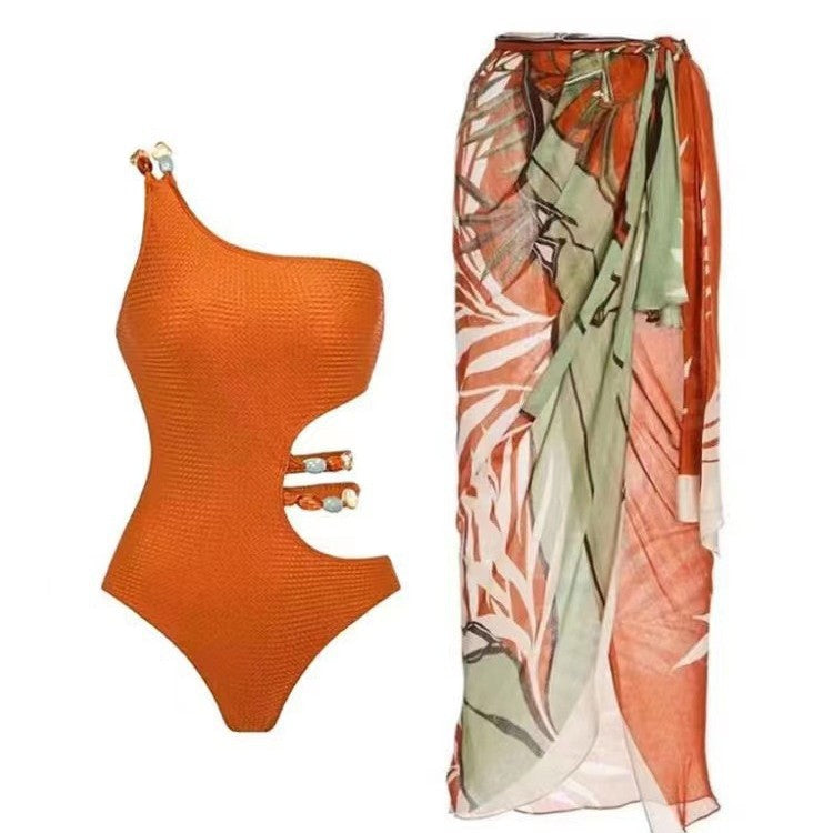 Women’s one-piece swimsuit with asymmetric cut and floral wrap skirt Mune Fashion