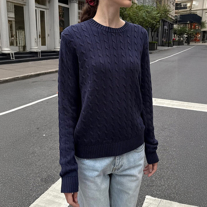 Women's large knitted cable knit sweater with round neckline, relaxed oversized fit, and ribbed cuffs Mune Fashion