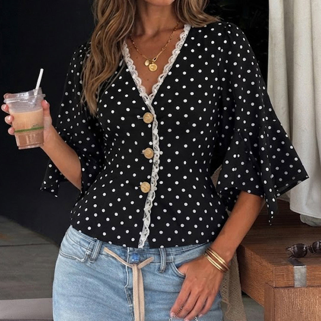 Ladies polka dot blouse with V-neck, lace trim and flared ruffle sleeves Mune Fashion