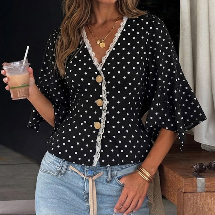 Ladies polka dot blouse with V-neck, lace trim and flared ruffle sleeves Mune Fashion