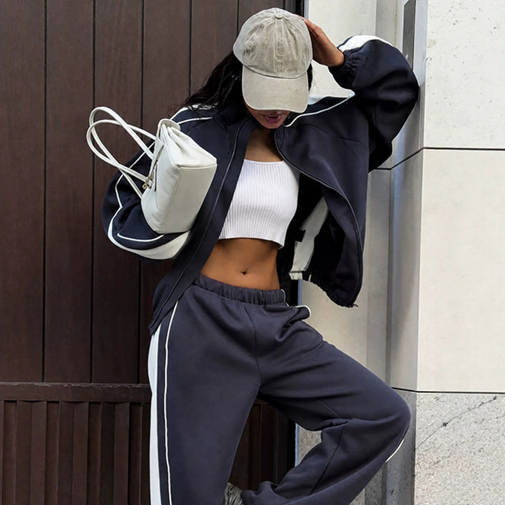 Women's oversized tracksuit with zip jacket, wide joggers, and contrast side stripes Mune Fashion