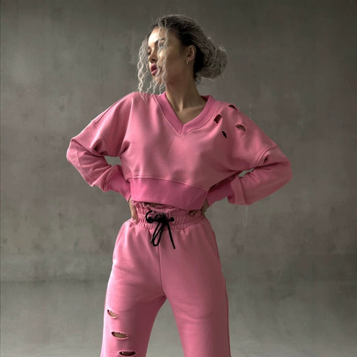 Ladies short-cut sweat set with V-neck, ruffled waistband high-waist joggers and distressed details Mune Fashion