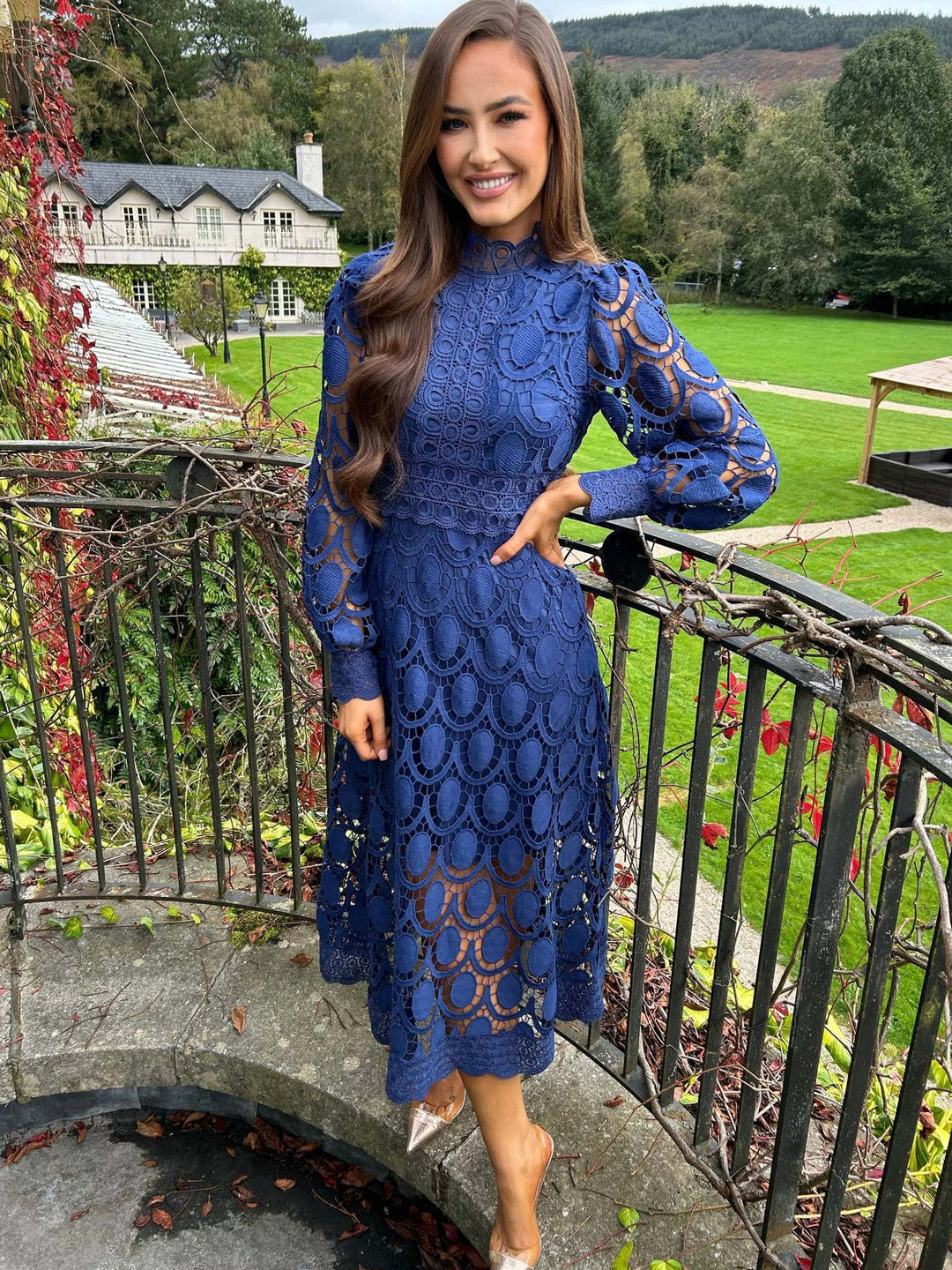 Women's crocheted midi dress with stand-up collar, transparent lace sleeves, and fitted A-line Mune Fashion