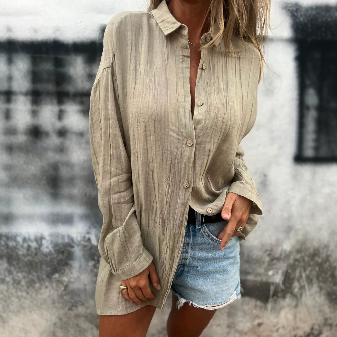 Women's casual oversized tunic shirt with linen texture, wood button placket, and elongated hem Mune Fashion