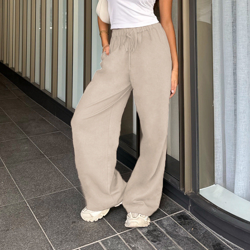 Women's wide jogging pants with high waistband, drawstring and palazzo silhouette Mune Fashion