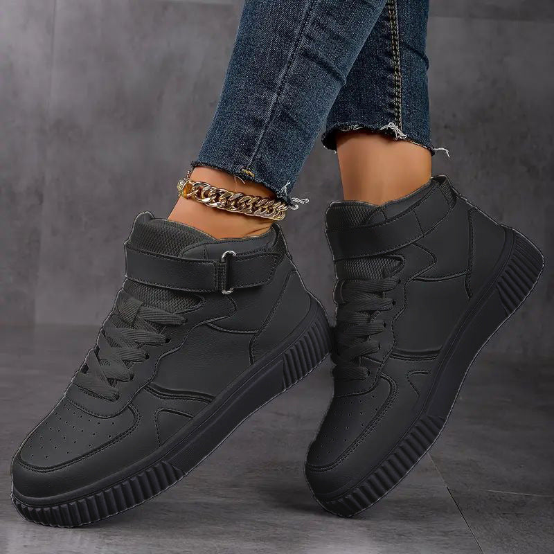 Women’s ankle-high polyurethane leather casual shoe with Velcro cuff, perforated toe cap, and textured rubber sole Mune Fashion