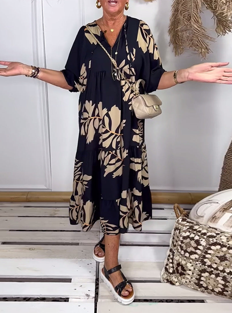 Women’s casual tiered midi dress with V-neck and large floral print Mune Fashion