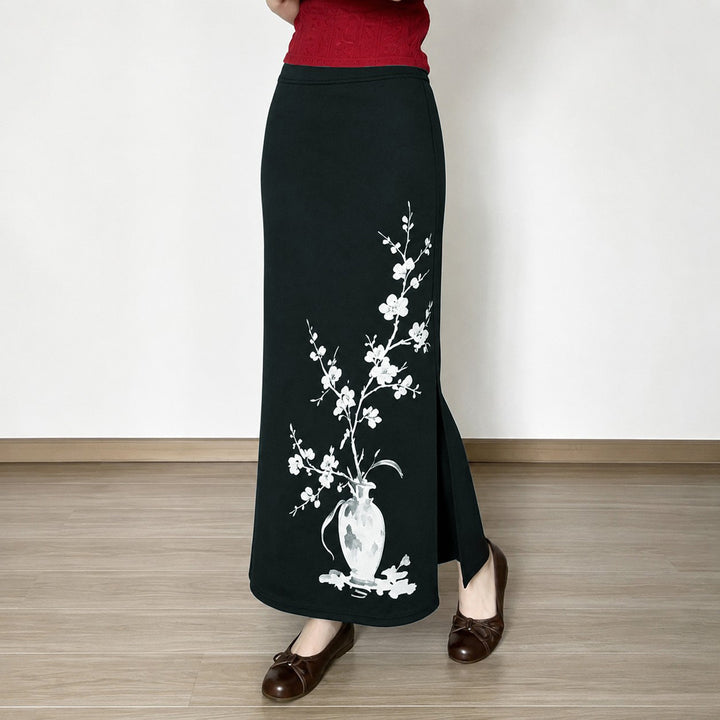 Women's flared maxi skirt with A-line cut, elastic waistband, and floral watercolor vase print Mune Fashion