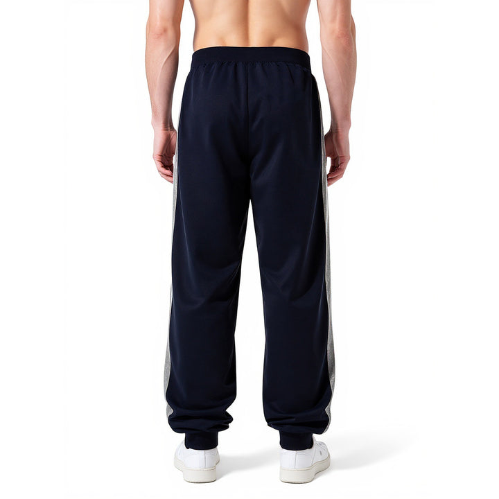 Men's sporty jogging pants with elastic waistband and side zip pockets Mune Fashion