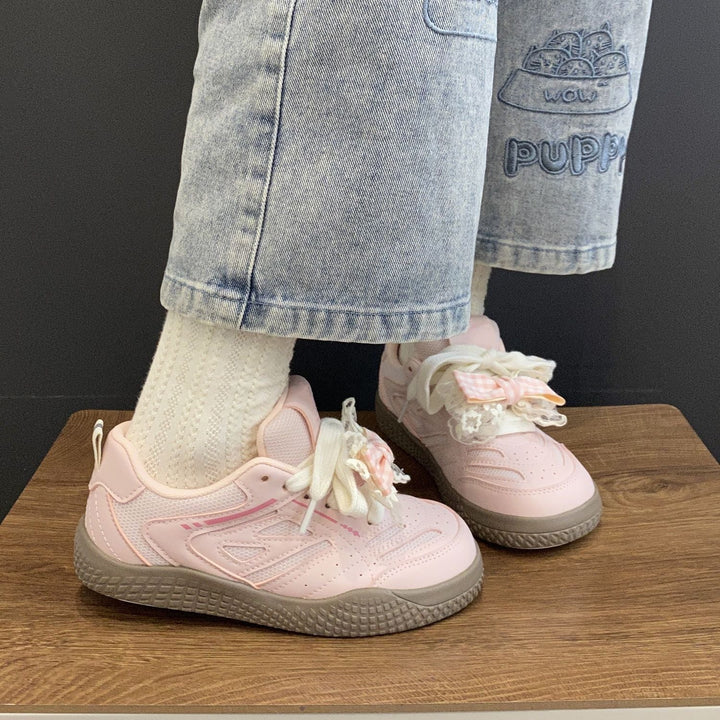 Women's sneakers with playful bow design by Mune Fashion
