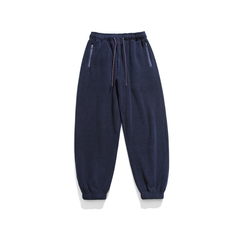 Men's wide-cut fleece jogging pants with elastic cuffs and side pockets Mune Fashion