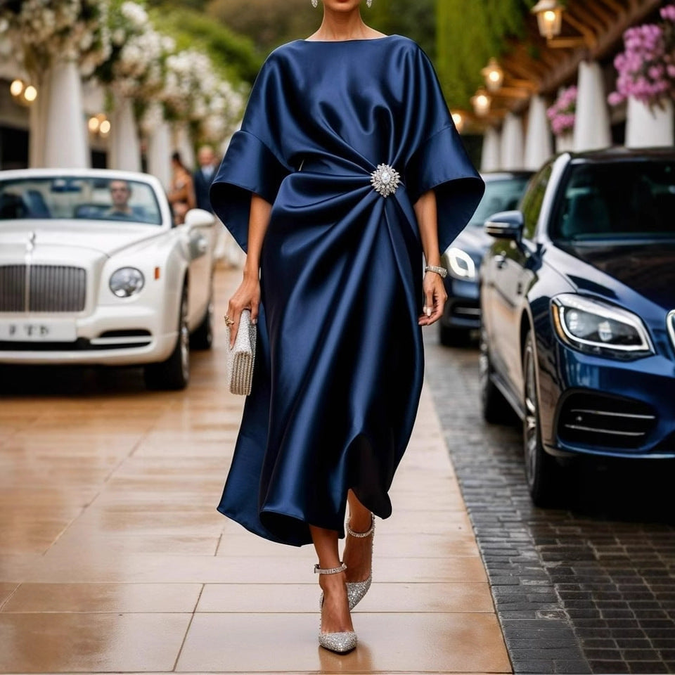 Women's elegant satin kaftan midi dress with kimono sleeves, side draping, and decorative brooch Mune Fashion