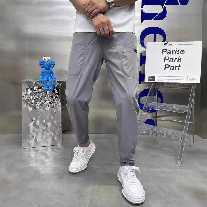 Men's sporty cargo jogger pants with elastic waistband, drawstring, and tapered leg hem Mune Fashion