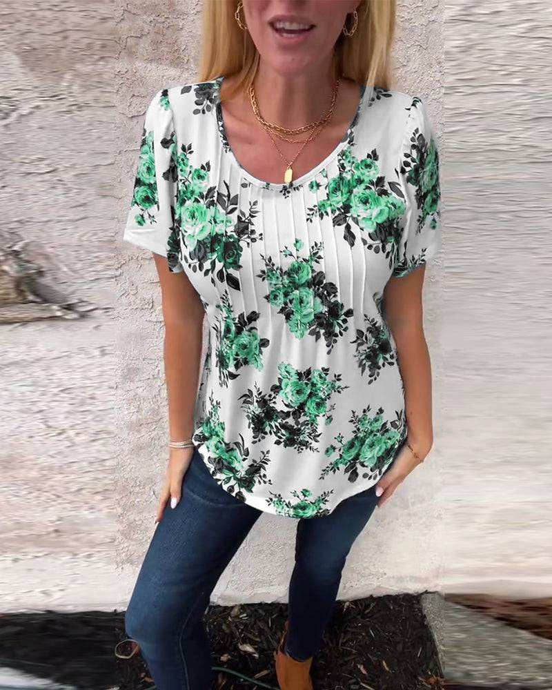 Women's short-sleeve blouse with box pleats, round neckline and floral all-over print Mune Fashion