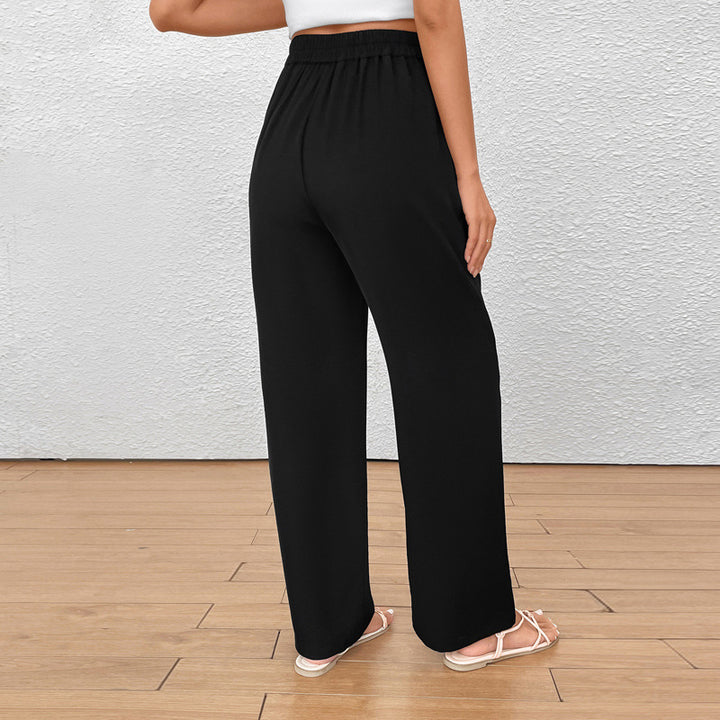 Ladies wide pleated trousers with high waist and button detail Mune Fashion