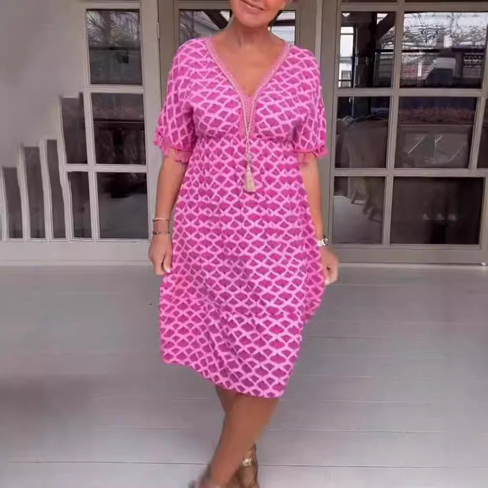 Women's casual midi dress in kaftan style with V-neck, tassel band, gathered empire seam, and fringe sleeves Mune Fashion