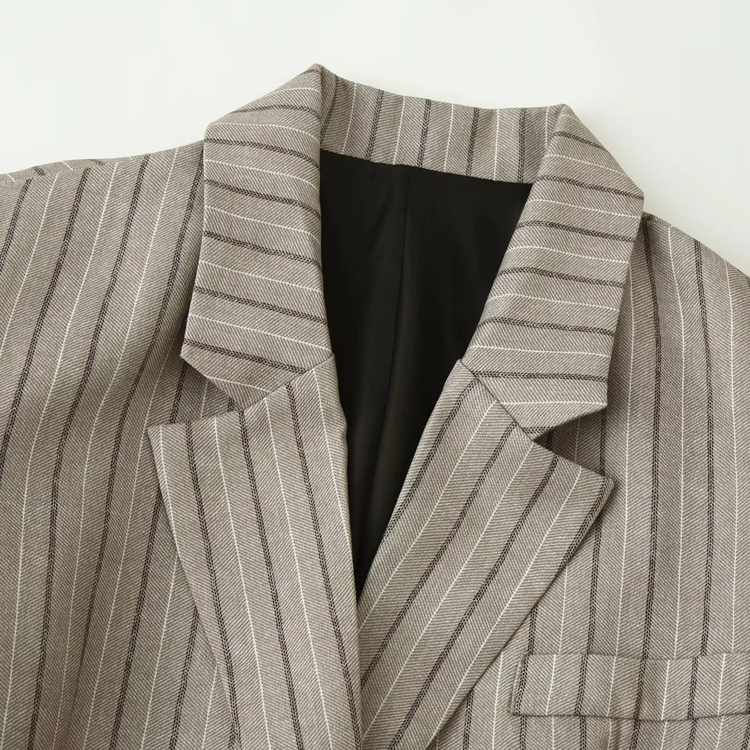 Women's fitted pinstripe blazer with decorative belt and flap pockets Mune Fashion