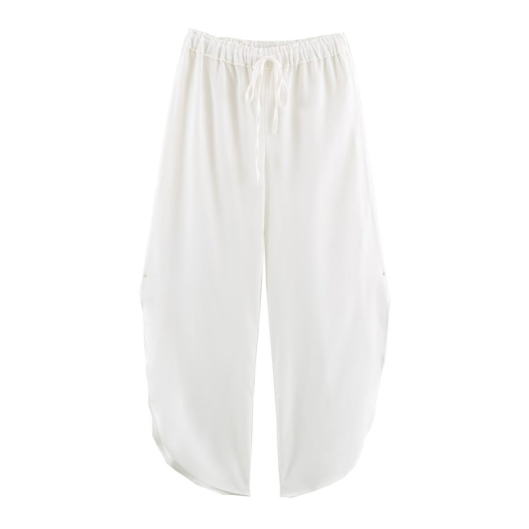 Ladies loose-fitting harem pants with drawstring waistband, mid-slit, and rounded hem Mune Fashion
