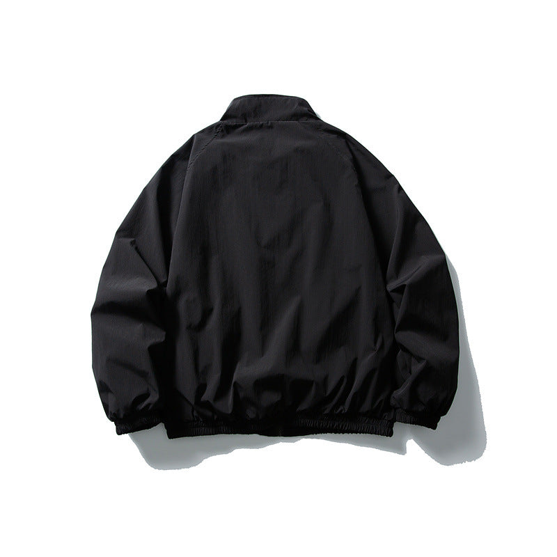 Unisex Lightweight water-repellent windbreaker with stand-up collar, raglan sleeves, and elastic hem Mune Fashion
