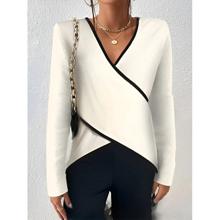 Women's wrap top with V-neckline, contrast piping, and asymmetric hem Mune Fashion