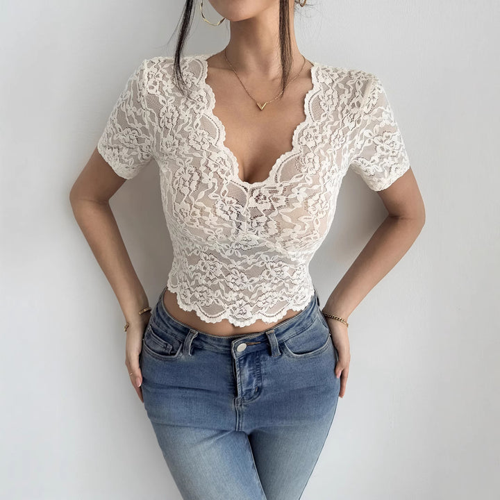 Ladies' short figure-hugging lace crop top with V-neck, wavy hem and elastic floral pattern lace Mune Fashion