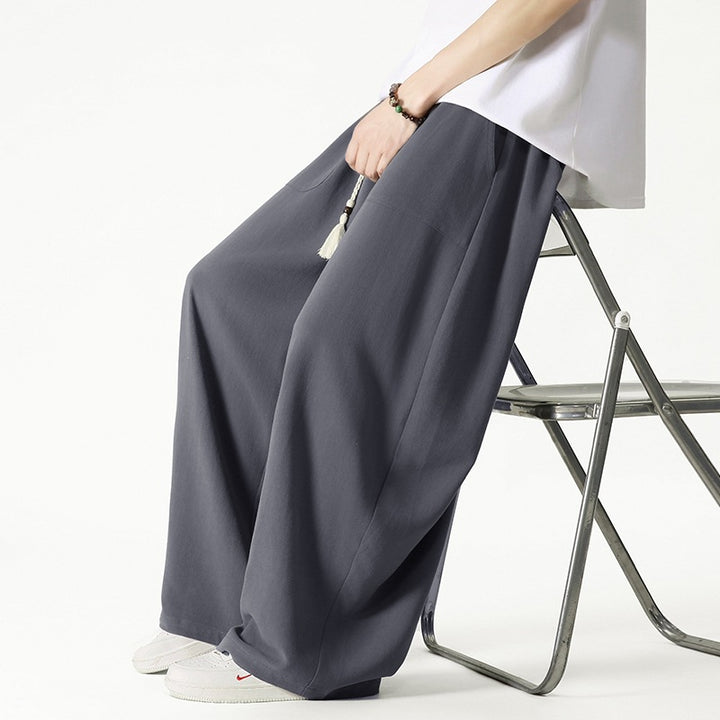 Men's loose-fitting lounge pants with tassel cord, elastic waistband, and patch pockets Mune Fashion