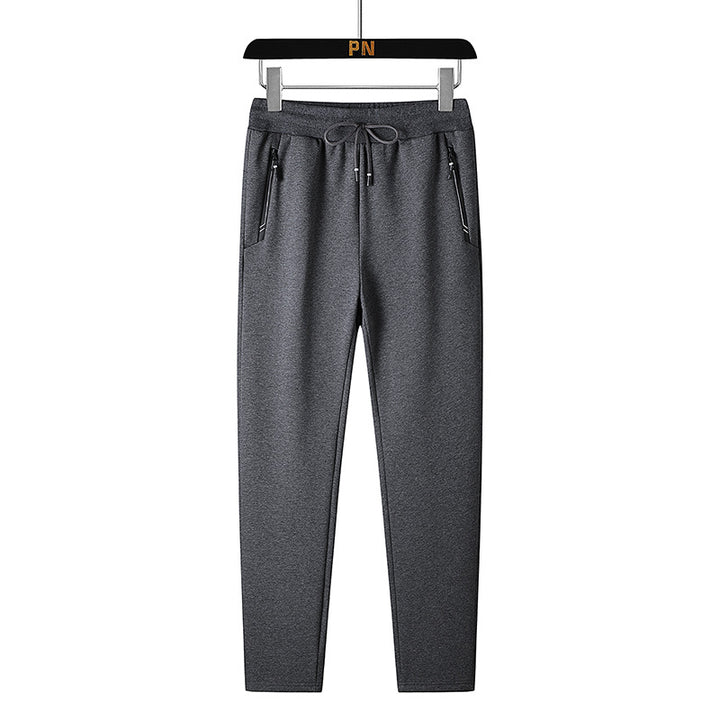 Men's thermo fleece jogging pants with brushed inner side, reflective zipper pockets and drawstring waistband Mune Fashion