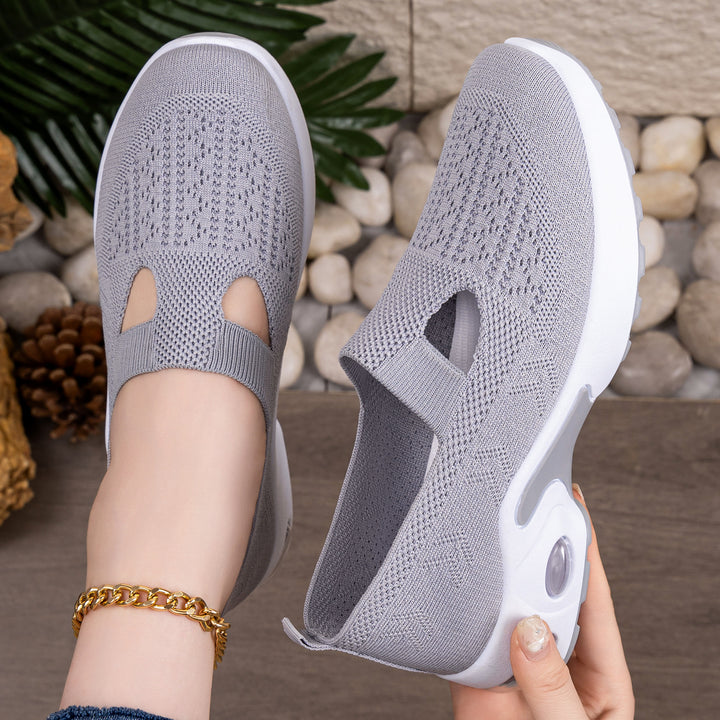 Women’s knitted slip-on sports slipper with elastic entry, cut-out detail, and visible air cushioning Mune Fashion