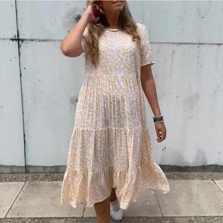 Women's flowing tiered maxi dress in Boho babydoll style with gathered underbust and short sleeves Mune Fashion