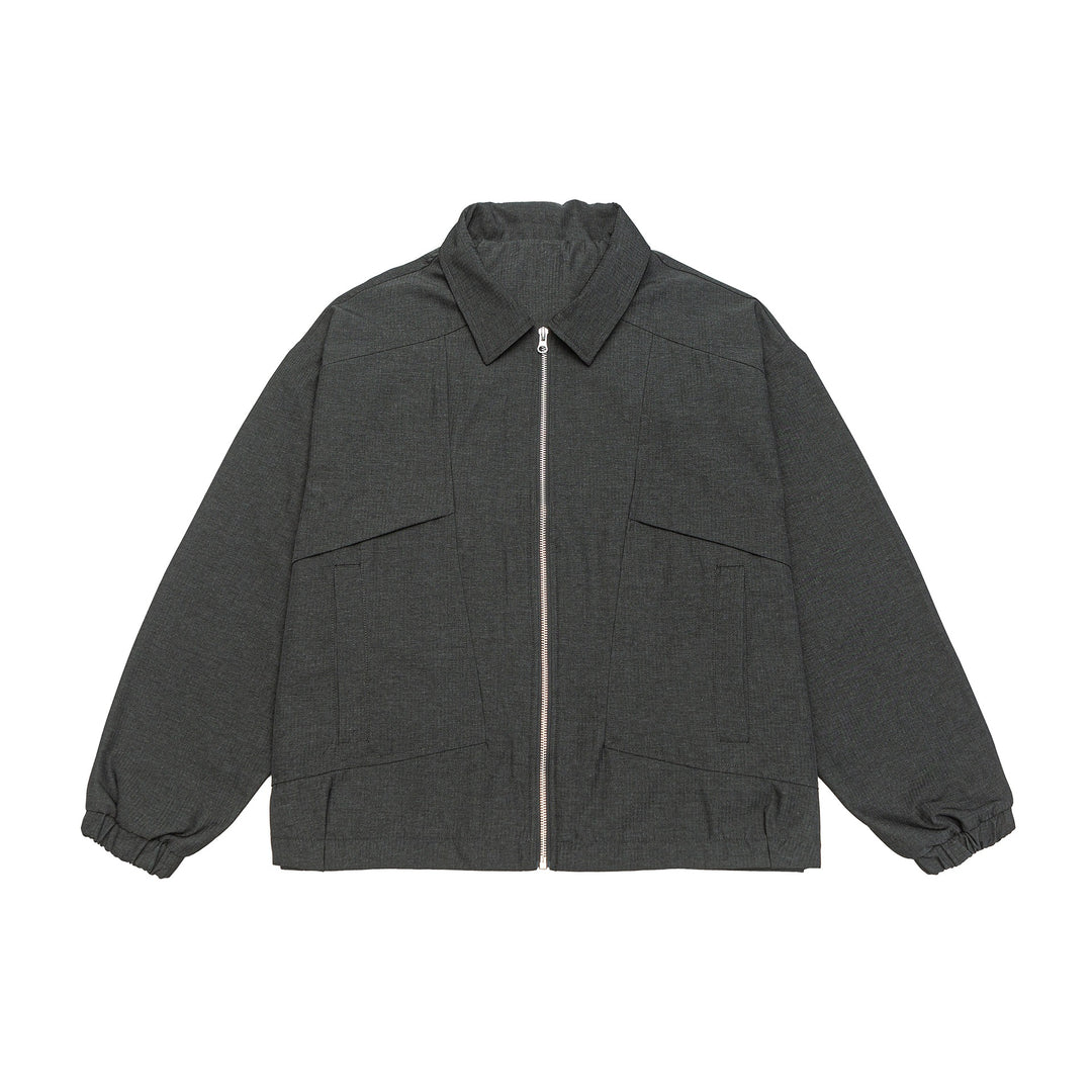 Unisex short jacket in boxy cut with shirt collar, visible metal zipper and utility patch pockets Mune Fashion