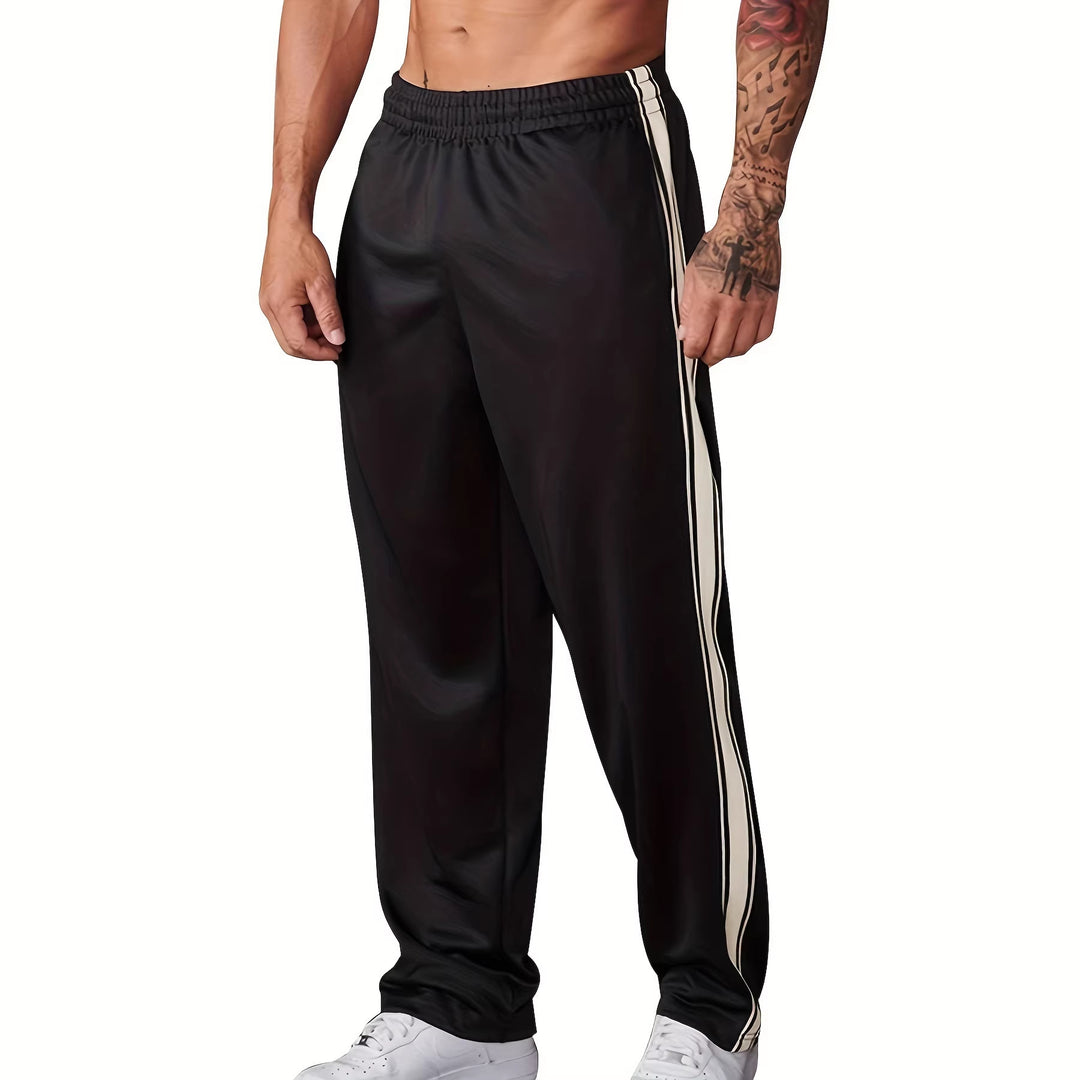 Men's sporty training pants with side tape stripes and elastic waistband Mune Fashion