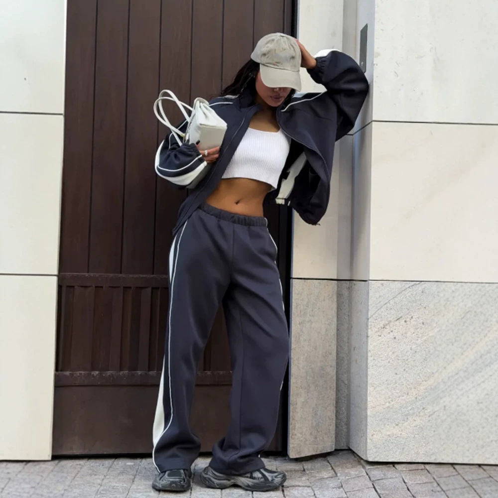 Women's oversized tracksuit with zip jacket, wide joggers, and contrast side stripes Mune Fashion