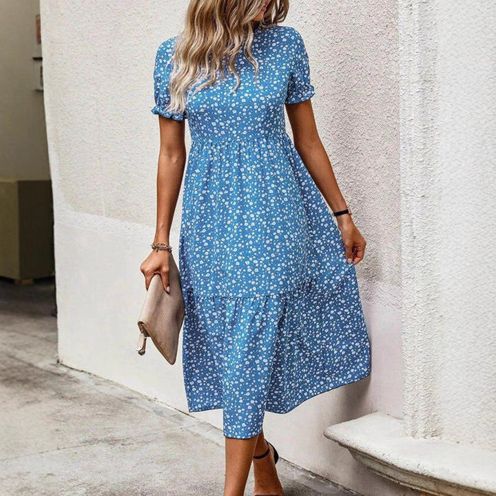 Women's airy midi dress with all-over floral pattern, gathered waist seam and short puff sleeves Mune Fashion