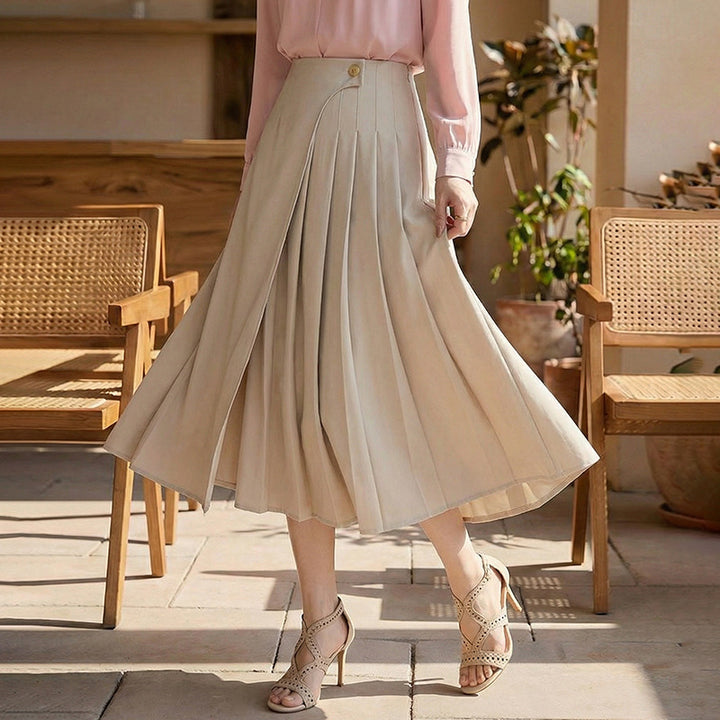 Women's high-waisted A-line skirt with asymmetrical pleats and decorative button closure Mune Fashion