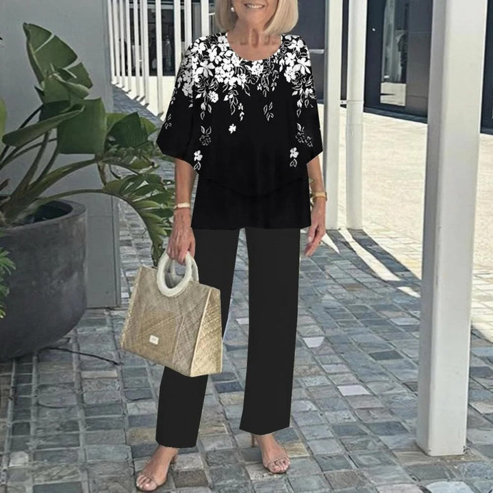 Women's layered tunic with cape sleeves and ankle-length straight leg pants with graphic print Mune Fashion