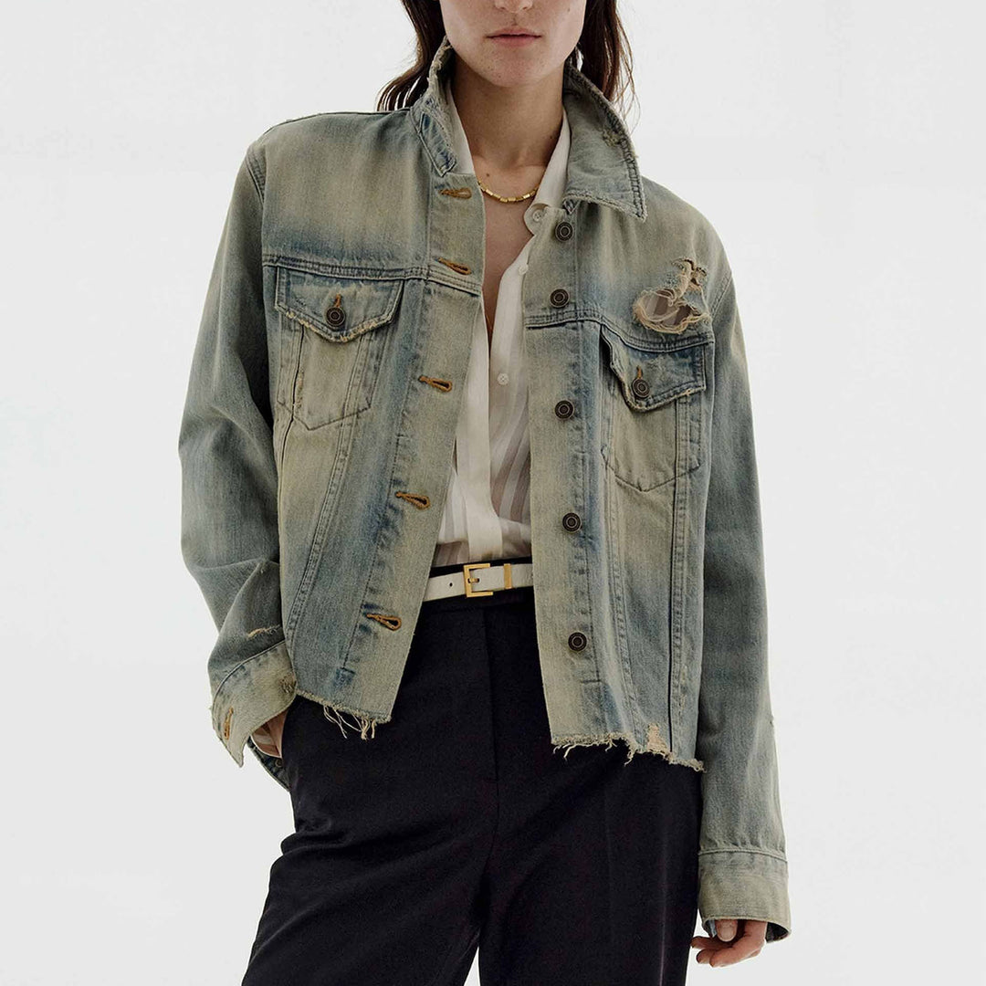 Women’s oversized destroyed denim jacket with raw hem, patch chest pockets, and vintage wash Mune Fashion